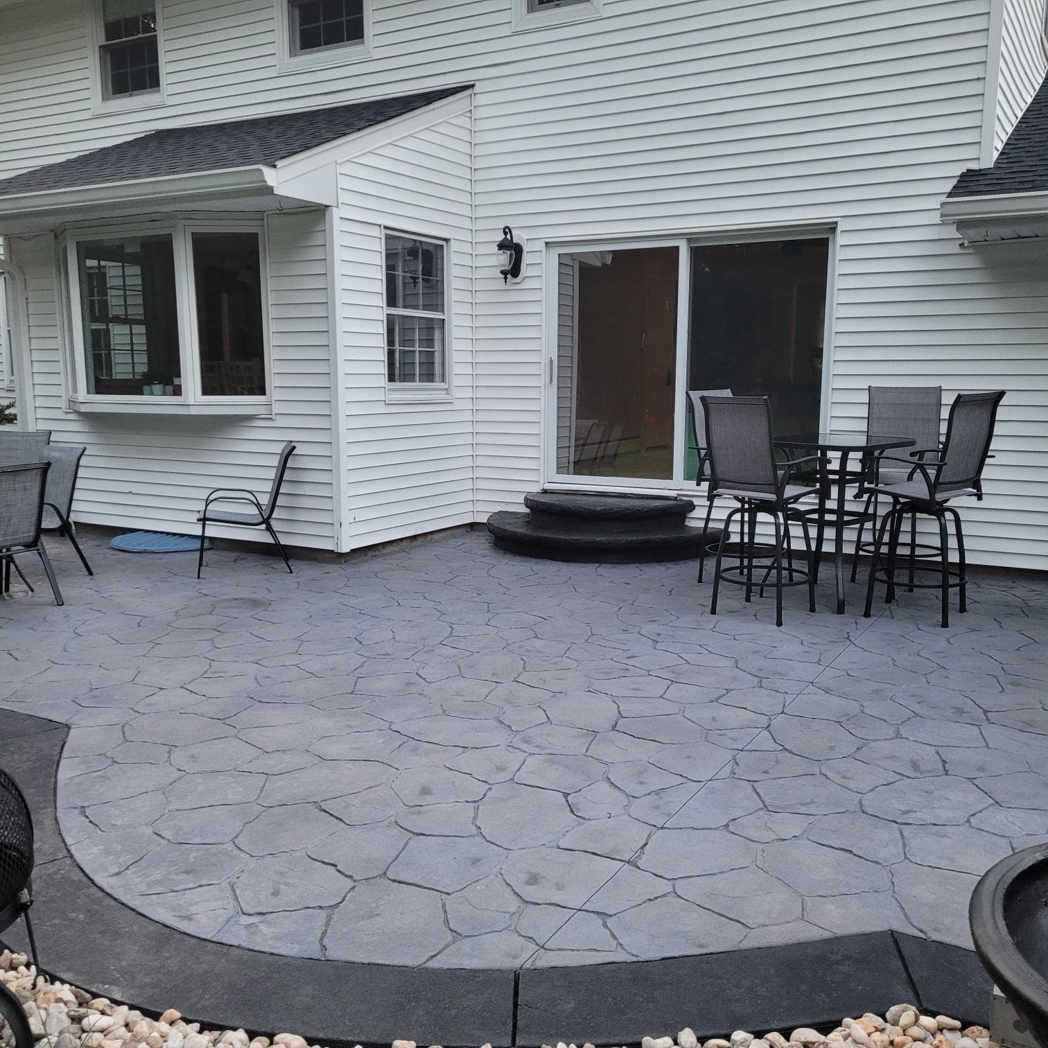 Stamped concrete driveway with natural stone pattern